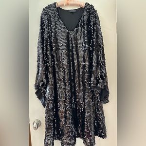 Black sequin A line dress with flare sleeves. Fully covered in sequins.